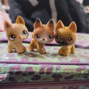 Three Small Brown Toy Fox Figurines